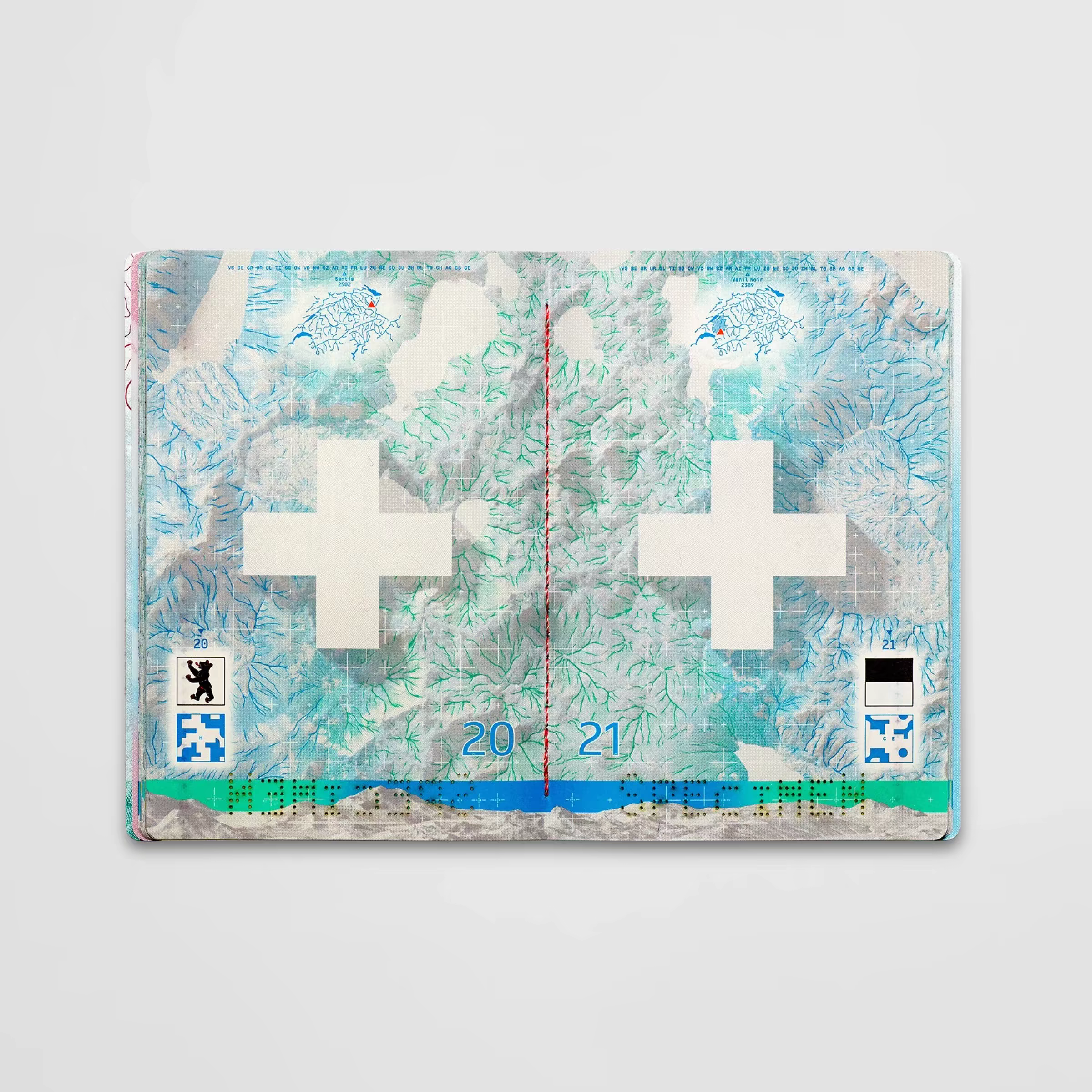 Swiss passport spread with white crosses